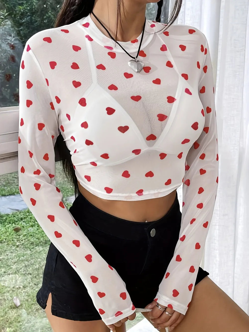Blusa transparente de cuello redondo tipo corazon y manga larga para mujer - foto 4